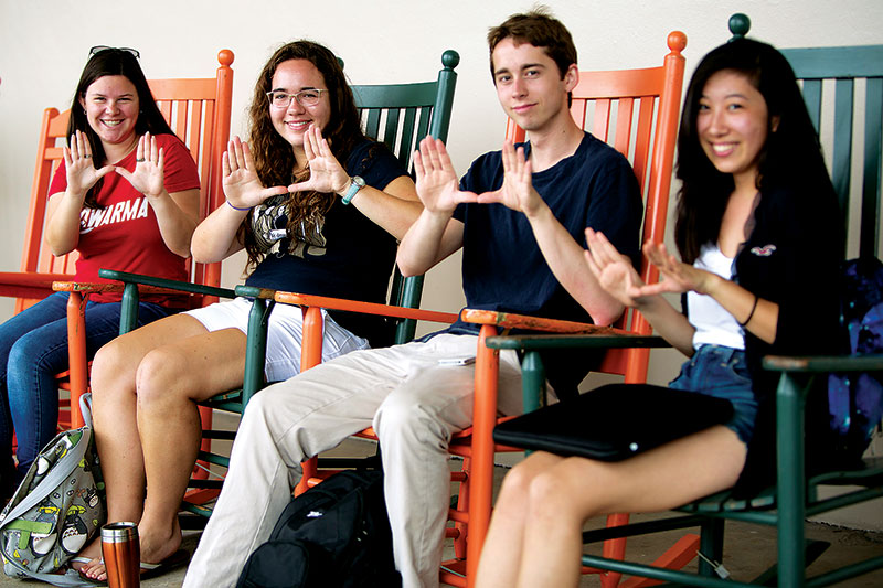 UM students rock! Students in rocking chairs.